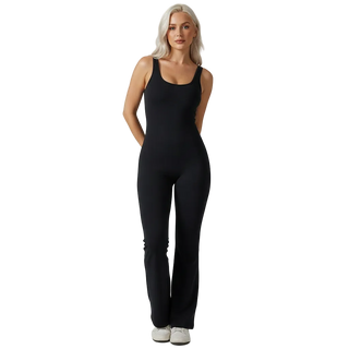 Woman wearing a black jumpsuit on a white background