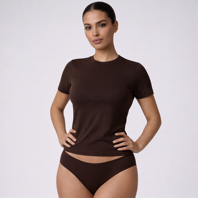 Woman wearing a brown t-shirt and underwear set on a white background