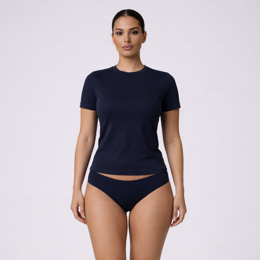 Woman wearing a navy blue t-shirt and high-waisted underwear on a white background