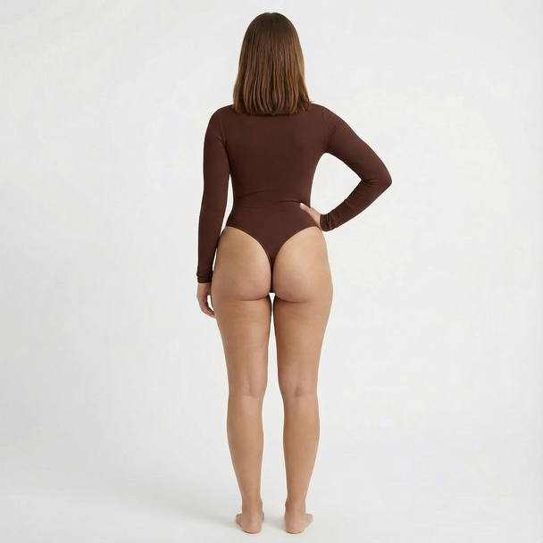 Person wearing a brown bodysuit on a white background