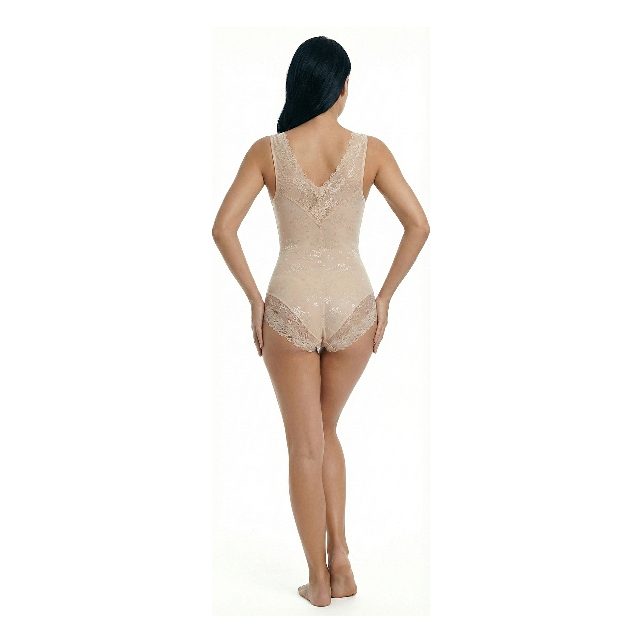 Woman wearing a beige lace bodysuit on a white background, back view