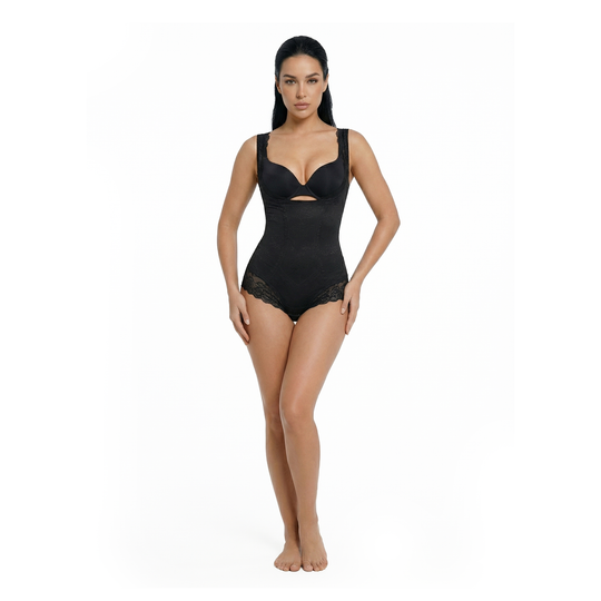 Woman wearing a black open-bust bodysuit on a white background, front view