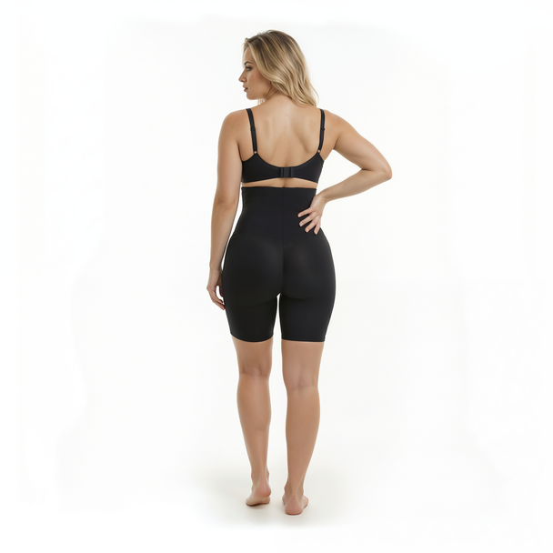 Woman wearing a black bodysuit on a white background