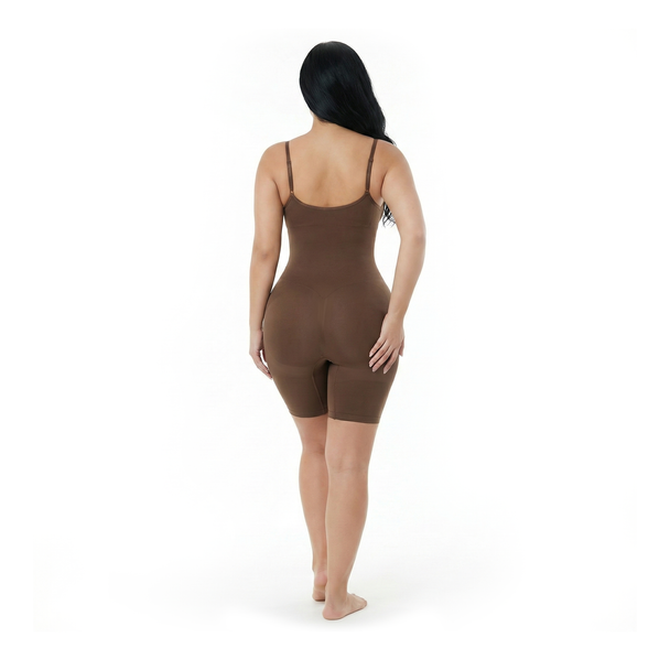 Woman wearing a brown mid-thigh bodysuit on a white background, back view