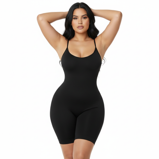Woman wearing a black shapewear bodysuit on a white background