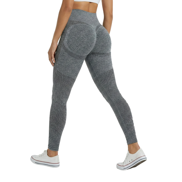 Person wearing gray leggings on a white background