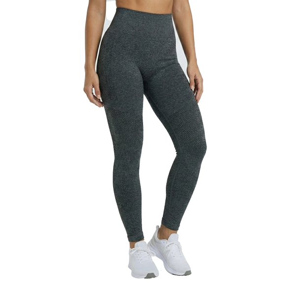 Person wearing dark gray leggings and white sneakers on a white background