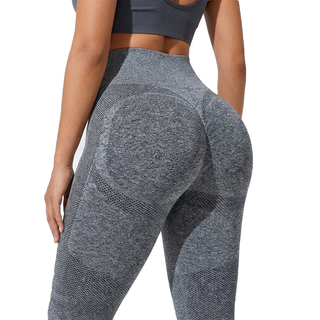 Gray athletic leggings worn by a person on a white background, back view