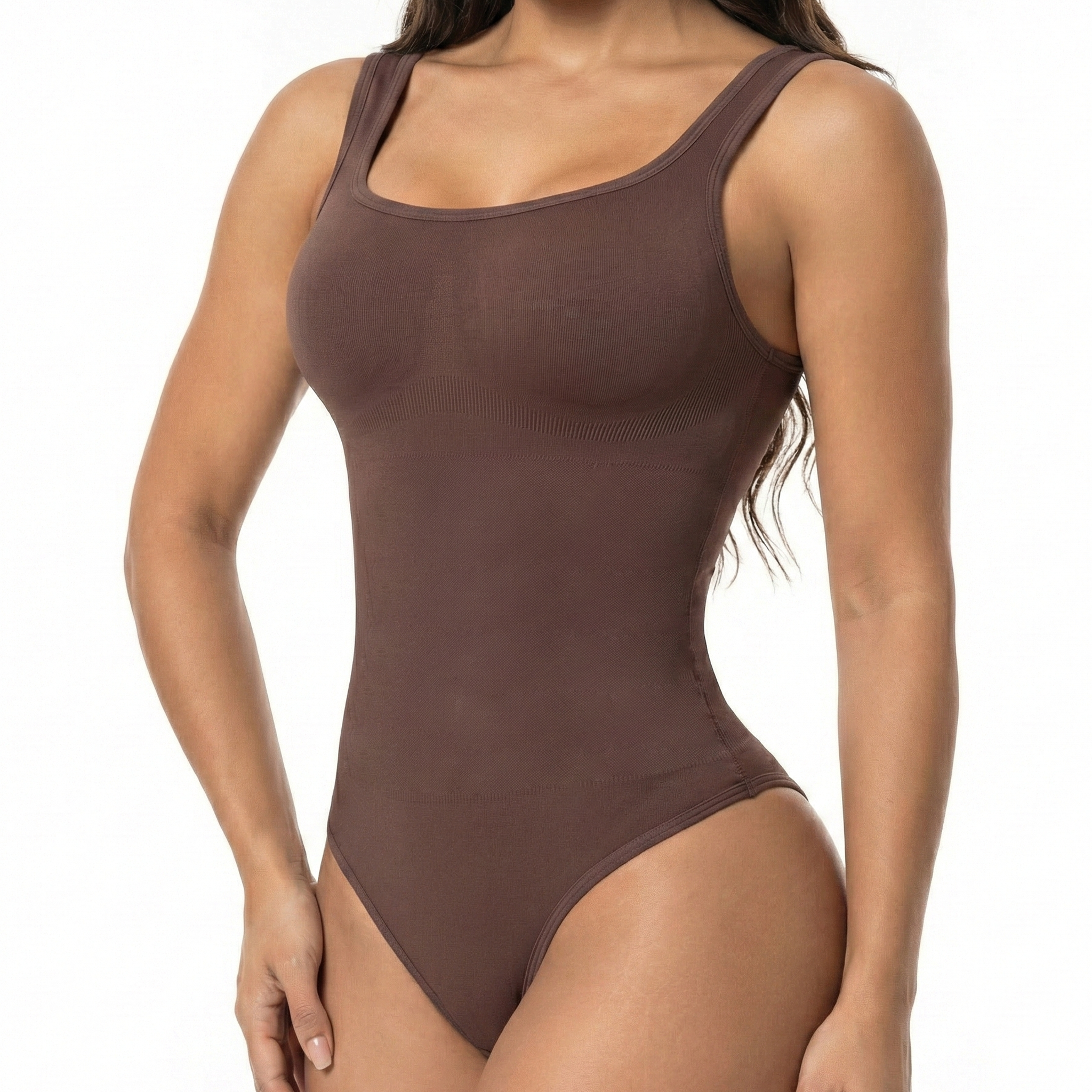 Brown thong bodysuit worn by a model on a white background