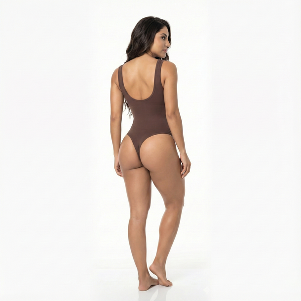 Woman wearing a brown thong bodysuit on a white background, back view