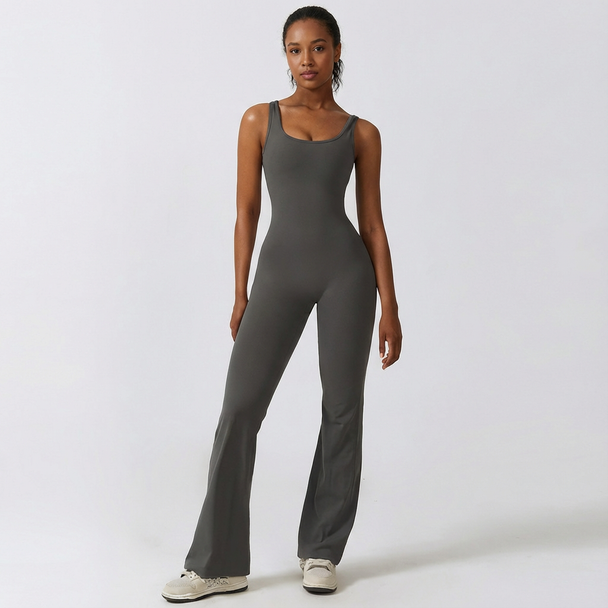 Woman wearing a gray jumpsuit on a white background